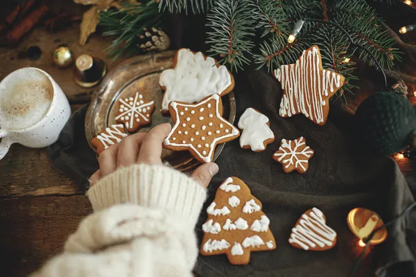 Hand Cozy Sweater Holding Gingerbread Cookie Star Rustic Moody Background — Stock Photo, Image