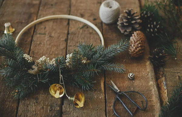 Modern Christmas Wreath Bells Fir Branches Pine Cones Thread Scissors — Stock Photo, Image