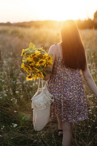 Stylish Young Female Floral Dress Walking Sunflowers Warm Sunset Light — стоковое фото