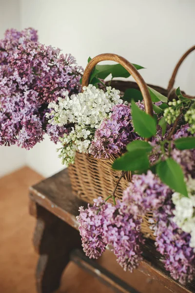 Beautiful Lilac Flowers Wicker Basket Wooden Chair Spring Rustic Still — Stock Photo, Image