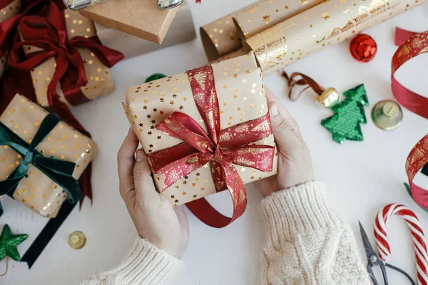 Person Preparing Modern Gift Box Red Ribbon Golden Wrapping Paper — 스톡 사진