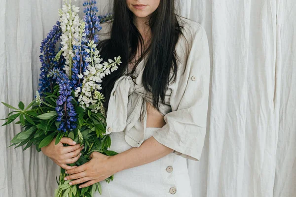 Stylish Woman Holding Lupine Bouquet Rustic Room Close Young Female — Stock Photo, Image