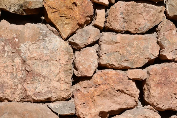Fondo Textura Piedra Pared Está Construida Grandes Piedras Facetadas —  Fotos de Stock