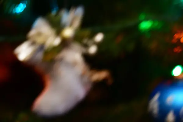 Blurred Christmas Background Stocking Gifts Branch Christmas Tree Bokeh — Stockfoto