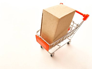 Mini shopping cart with crate in the shopping making payment on isolated backgrounds