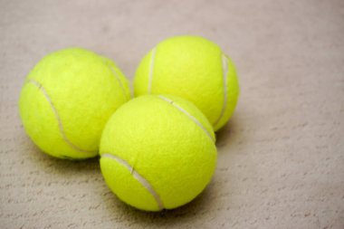 Three tennis balls on isolated background