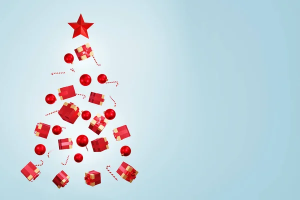 Χριστουγεννιάτικο δέντρο φτιαγμένο από κουτιά δώρων, καραμέλες και μπάλες σε μπλε φόντο. Φωτογραφία Αρχείου