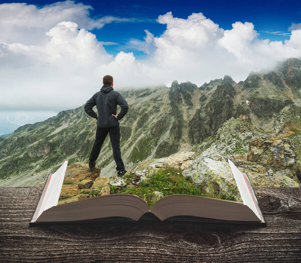 Hiker in a Caucasus mountains on a pages of an open book. Travel and education concept.