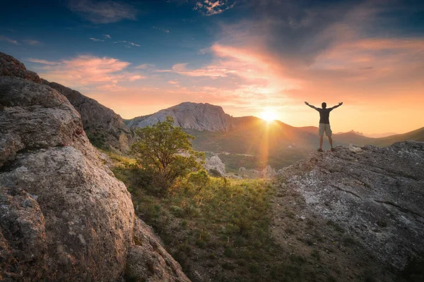 Active Hiker Man Raised Hands Standing Rocky Hill Colorful Sky — Stock Photo, Image