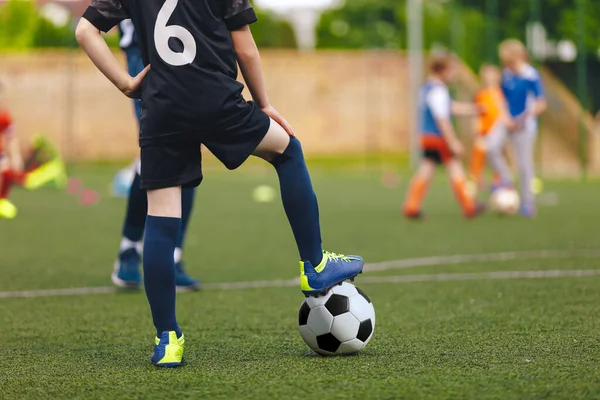 Football Education for Youths. Young Footballer Running Ball During Soccer Training Unit