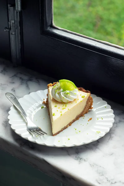 Slice Key Lime Pie Whipped Cream Lime Zest Plate Marble — стоковое фото