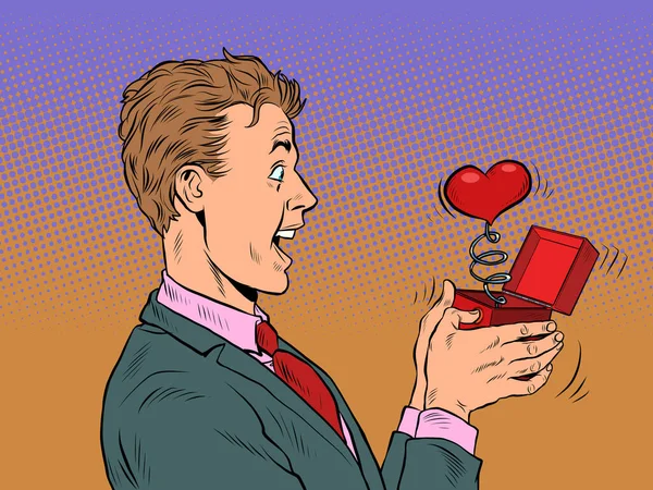 A businessman man looks at a red heart box valentine surprise greeting, love romance — Archivo Imágenes Vectoriales