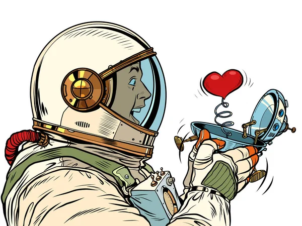 Şaşırmış erkek astronot UFO uçan bir gemi kutusundaki kırmızı kalbe bakar. Sürpriz sevgililer günü hediyesi, aşk romantizmi. — Stok Vektör