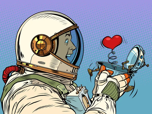 Överraskad manlig astronaut tittar på ett rött hjärta i en UFO flygande fartyg box valentine överraskning hälsning, kärlek romantik — Stock vektor