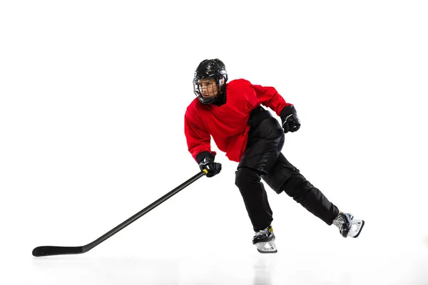 Full-length portrait of professional female hockey player training isolated over white background. Stickhandling — Stock Photo, Image