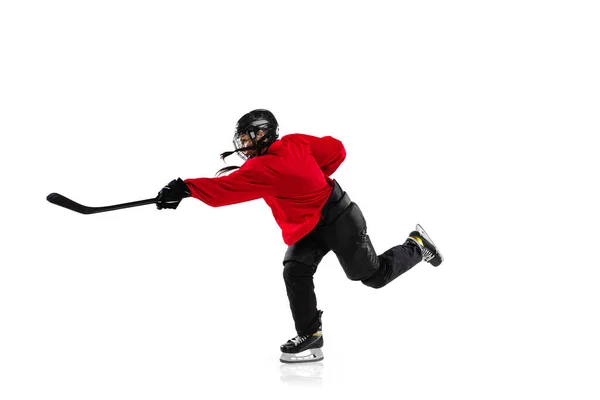 Full-length side view portrait of woman, professional hockey player in motion, training isolated over white background. High sticking game — Stock Photo, Image