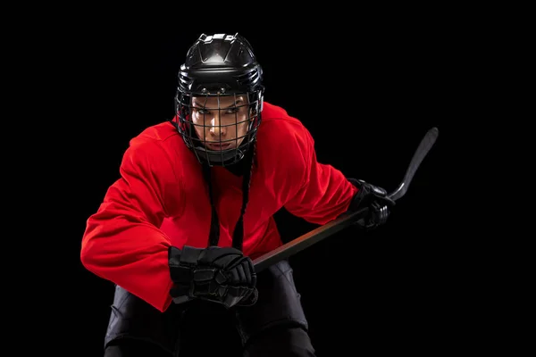 Cropped portrait of professional female hockey player, goalkeeper training isolated over black background. — Stock Photo, Image