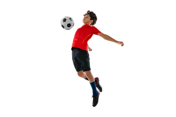 Ritratto a figura intera di ragazzo, adolescente, calciatore professionista in movimento isolato su sfondo bianco — Foto Stock
