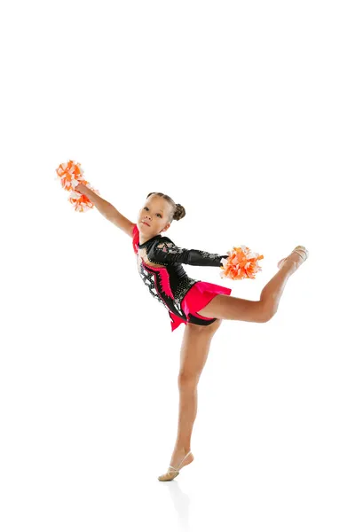 Full-length portret van meisje, kind training cheerleading geïsoleerd over witte achtergrond — Stockfoto