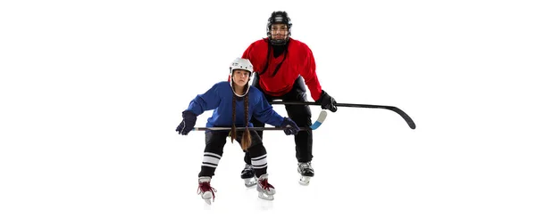 Colagem de mulher e menina, jogadores profissionais de hóquei em uniforme com capacete e vara de treinamento isolado sobre fundo branco — Fotografia de Stock