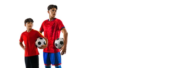 Collage de niño y adolescente, jugador de fútbol en uniforme rojo y azul posando aislado sobre fondo blanco — Foto de Stock