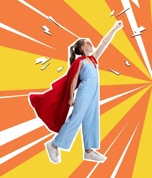 Contemporary art collage, creative design of little girl wearing red cloak and standing like superhero isolated over orange yellow background — Stock Photo, Image