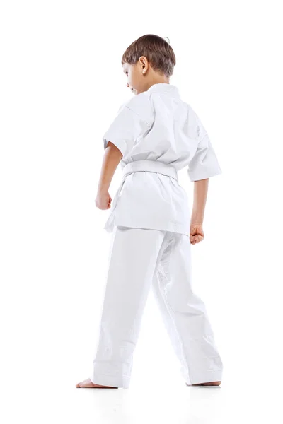 Vissza nézet portré a kisfiú fehér kimono, harcművészeti sportoló pózol elszigetelt fehér háttér — Stock Fotó