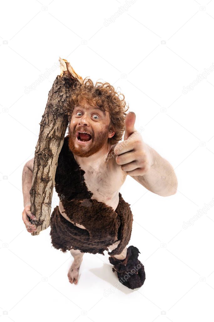 Full-length portrait if cheerful man in character of neanderthal showing like gesture isolated over white background