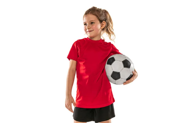 Retrato recortado de niña, niño, jugador de fútbol en entrenamiento uniforme rojo, posando aislado sobre fondo blanco —  Fotos de Stock