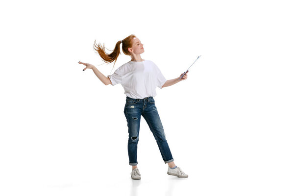 Full-length portrait of young girl,motivated student doing presentation isoated over white background