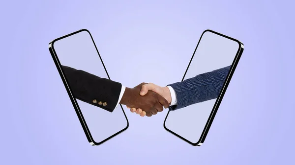 Collage of two shaking hands sticking out phone screen isolated over blue background — Zdjęcie stockowe