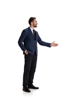Full-length side view portait of businessman lending hand for shaking isolated over white background