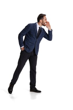 Full-length portrait of man, office worker whispering information isolated over white background
