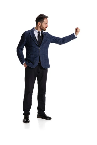 Full-length portrait of businessman showing warning fist isolated over white background — Stockfoto