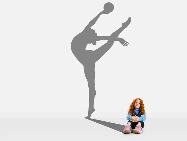 Little redhaired girl dreaming of becoming famous rhytmic gymnast — Stock Photo, Image