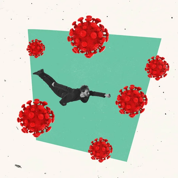 Creatief ontwerp. Zakenman, dappere man die vliegt als een superheld over viruscellen, symboliseert de bereidheid om te vechten tegen de wereldwijde ziekte. — Stockfoto