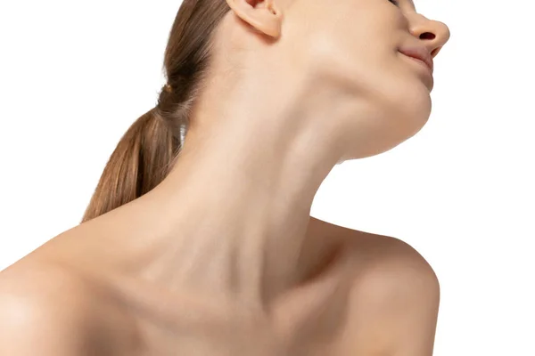 Cropped image of slim, tender female neck and shoulders isolated over white studio background. Sensuality — Stock Photo, Image