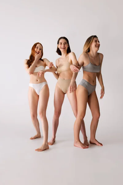 Portrait Three Beautiful Cheerful Women Posing Underwear Isolated Grey Studio — Stock Photo, Image