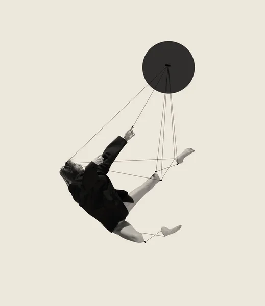 Contemporary art collage with young woman, ballerina attached to strings and falling down isolated on grey background. Line art design. Concept of classic dance style, art, show, beauty, inspiration