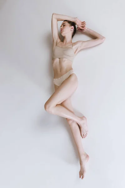 Portrait Slim Muscular Woman Lying Floor Cotton Underwear Posing Isolated — Stock Photo, Image