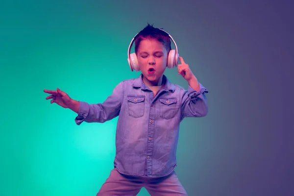 Portrait Emotive Little Boy Child Listening Music Headphones Posing Isolated — Stockfoto