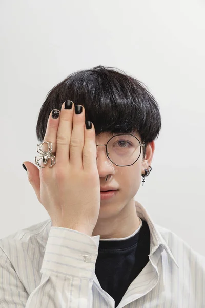 Portrait Stylish Young Man Piercing Glasses Covering Half Face Hand — Stockfoto