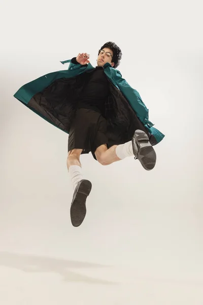 Portrait Stylish Young Man Black Outfit Green Coat Posing Jump — Stockfoto