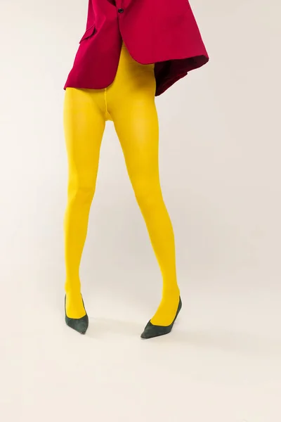 Cropped Image Female Legs Yellow Bright Tights Heels Isolated Grey — ストック写真
