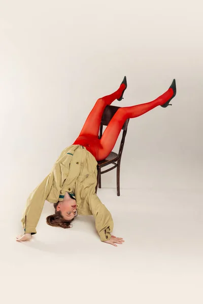 Portrait Young Girl Red Tights Stylish Jacket Posing Falling Chair — Photo