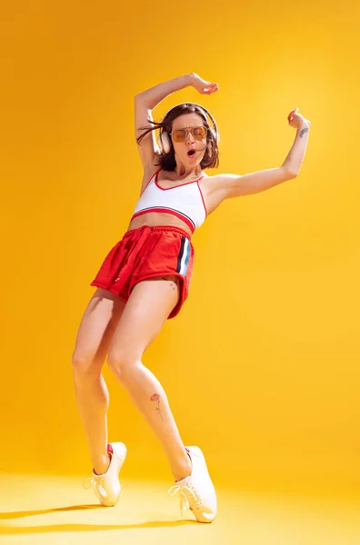 Cheerful Young Woman Top Red Shorts Posing Dancing Listening Music — ストック写真