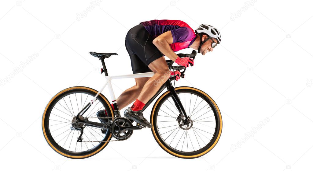 Portrait of man, professional cyclist training, riding isolated over white studio background. Developing speed. Concept of sport, action, motion, speed, hobby, lifestyle. Copy space for ad