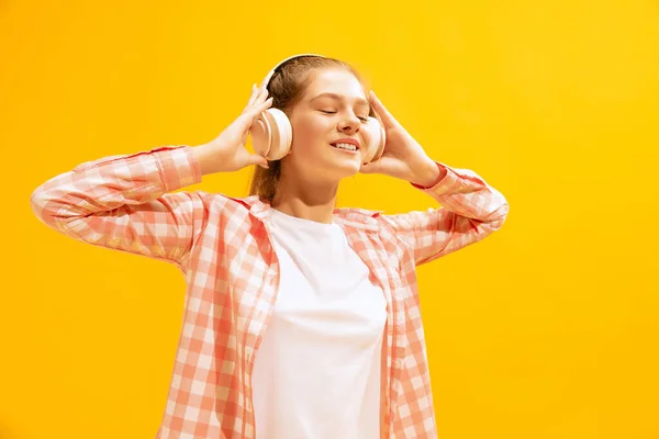Portrait Young Girl Listening Music Headphones Isolated Yellow Background Pleasant — ストック写真