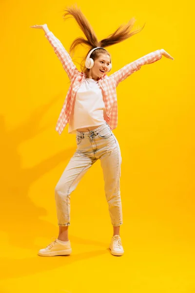 Portrait Young Girl Posing Headphones Isolated Yellow Studio Background Cheerful — стоковое фото