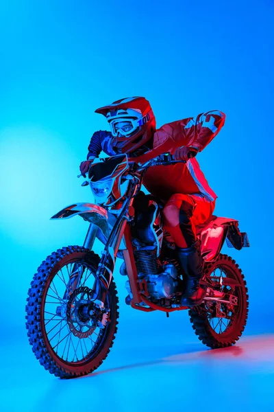 Portrait Young Man Biker Riding Motorbike Isolated Blue Studio Background — Zdjęcie stockowe